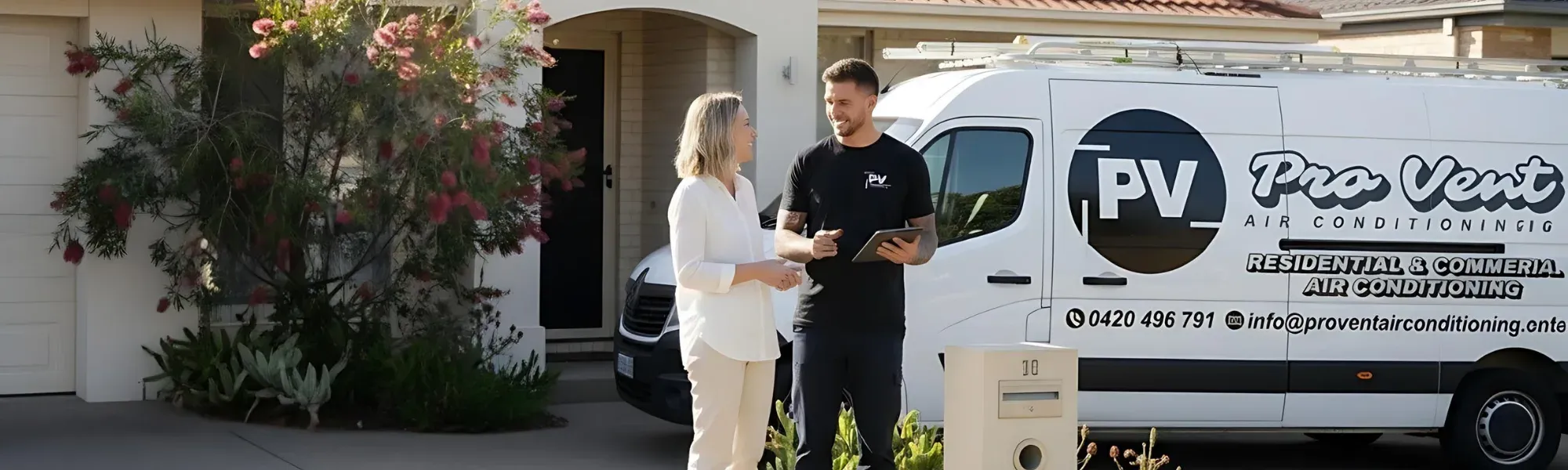 Pro Vent technician handing over to a homeowner beside the work van
