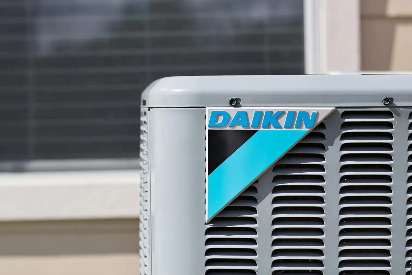 Daikin outdoor air conditioning unit installed against a Perth home
