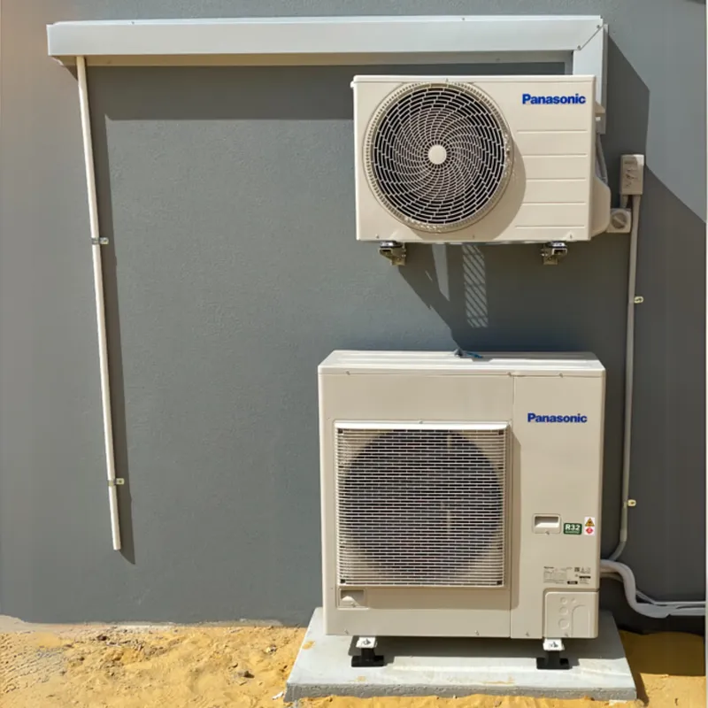 Two Panasonic split system outdoor units stacked on a wall bracket