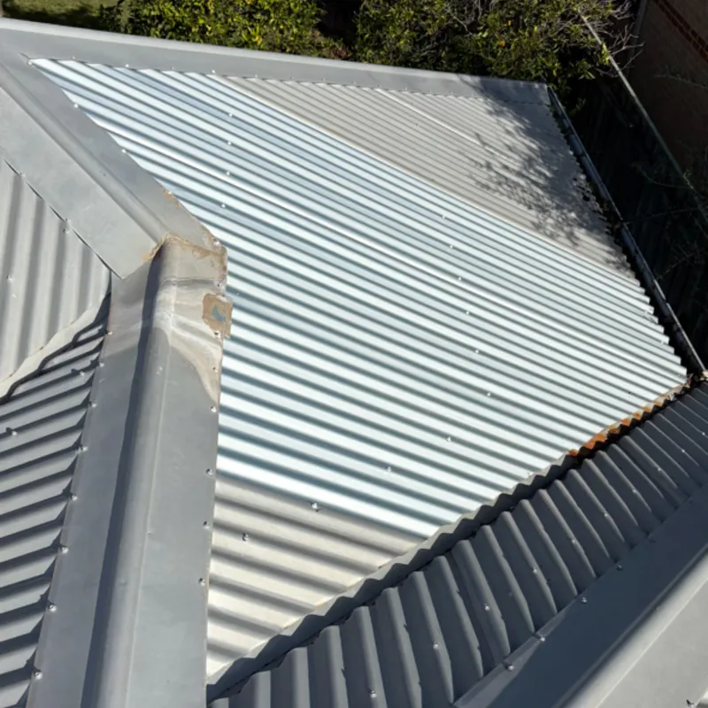 Repaired metal roof after removing an old evaporative cooler