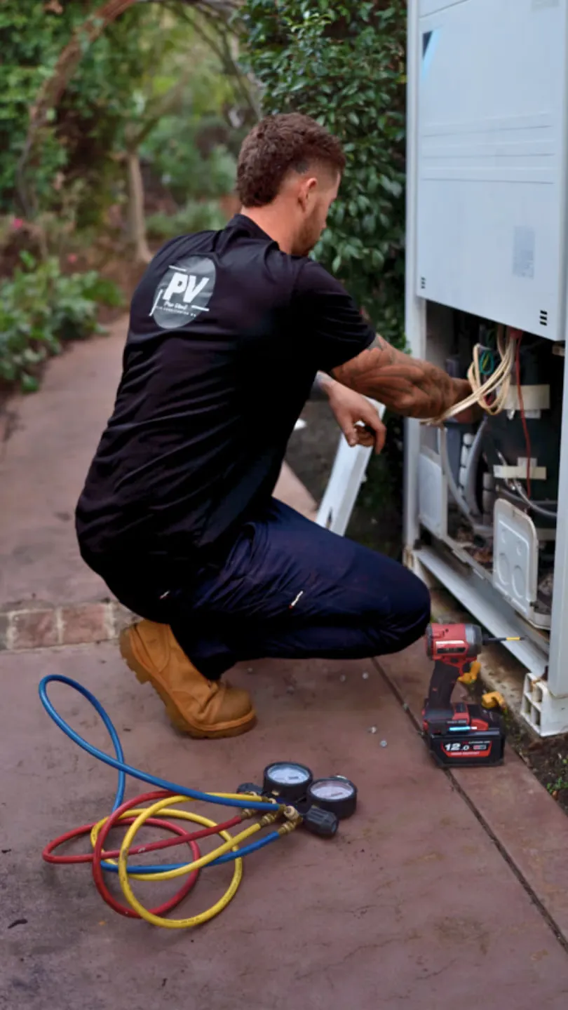 Pro Vent technician working on an air conditioning unit
